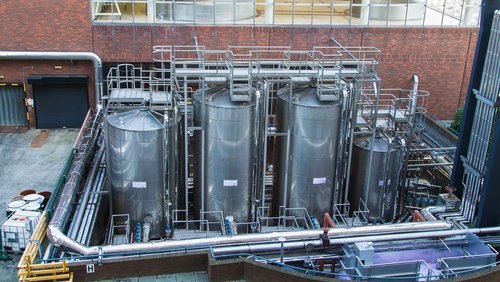 Guinness brewery, Dublin, Ireland - fermentation vessels and tubes of a beer brewery.